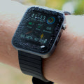 Image of the Life Watch - Deluxe screen with droplets of water on it, showcasing its waterproof feature.